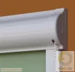Tokozott gyöngyláncos roletta - Polka (fényzáró, alupigmentált textillel)